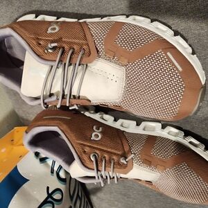 On Running Brown and White Sneakers